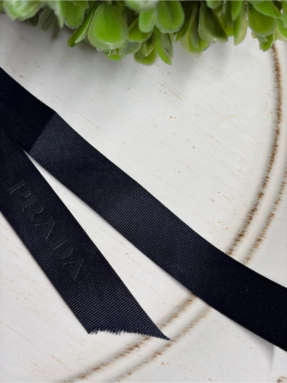 Prada Black Ribbon  hair clip and leather zipper pull tab